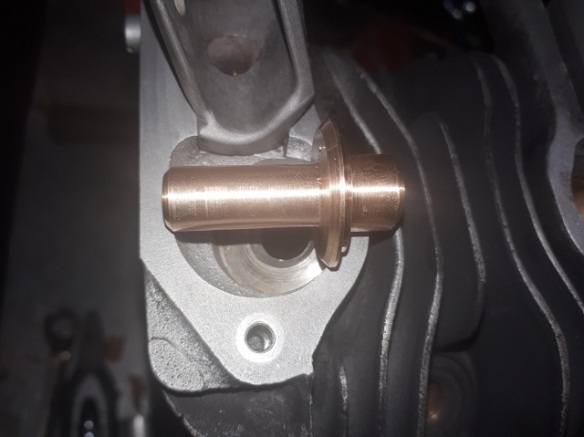 A machined valve guide.